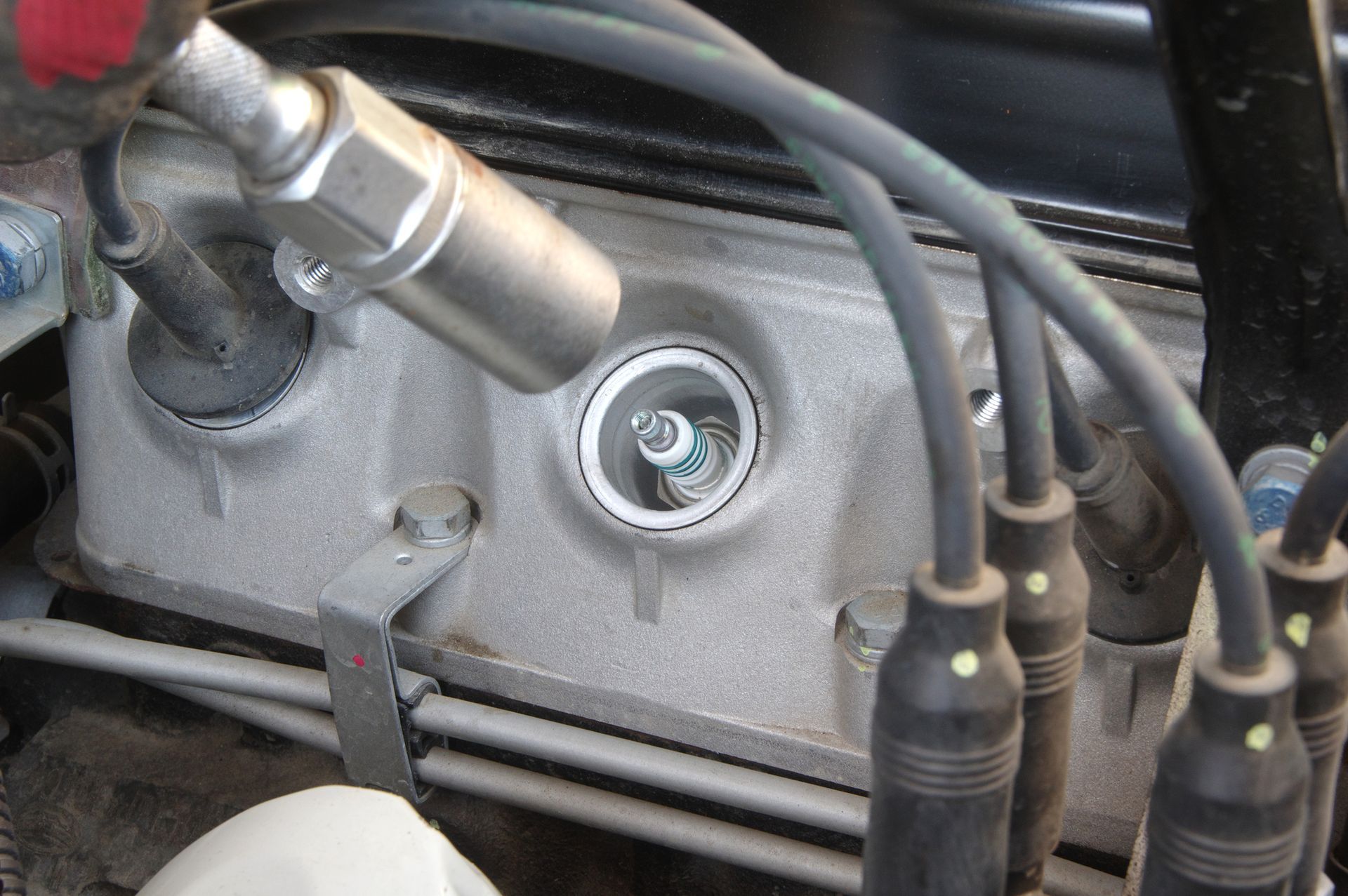 A close up of a spark plug on a car engine