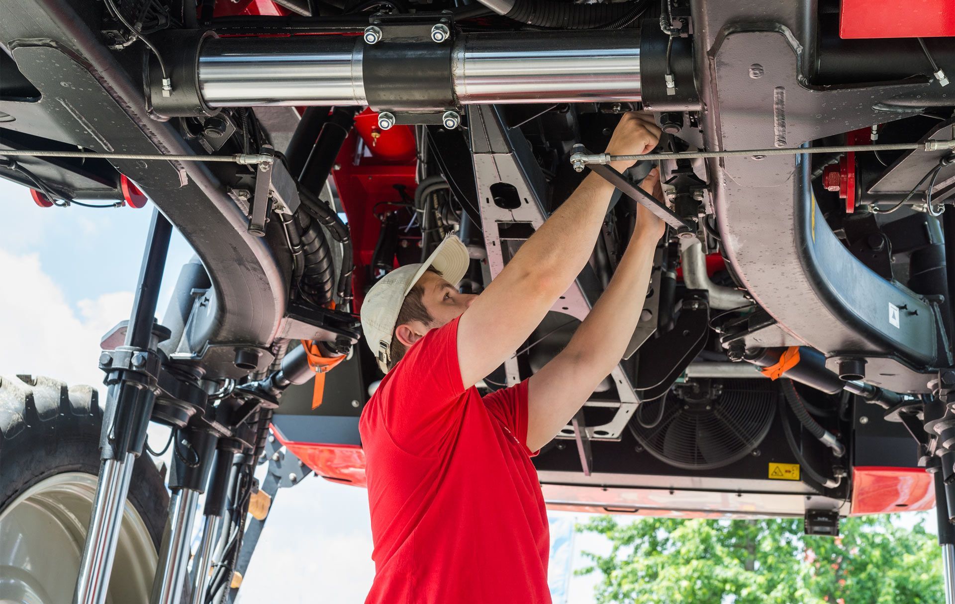 Man Repairing Engine Under Chasis | Ararat, Vic | Ararat Auto & Ag Services