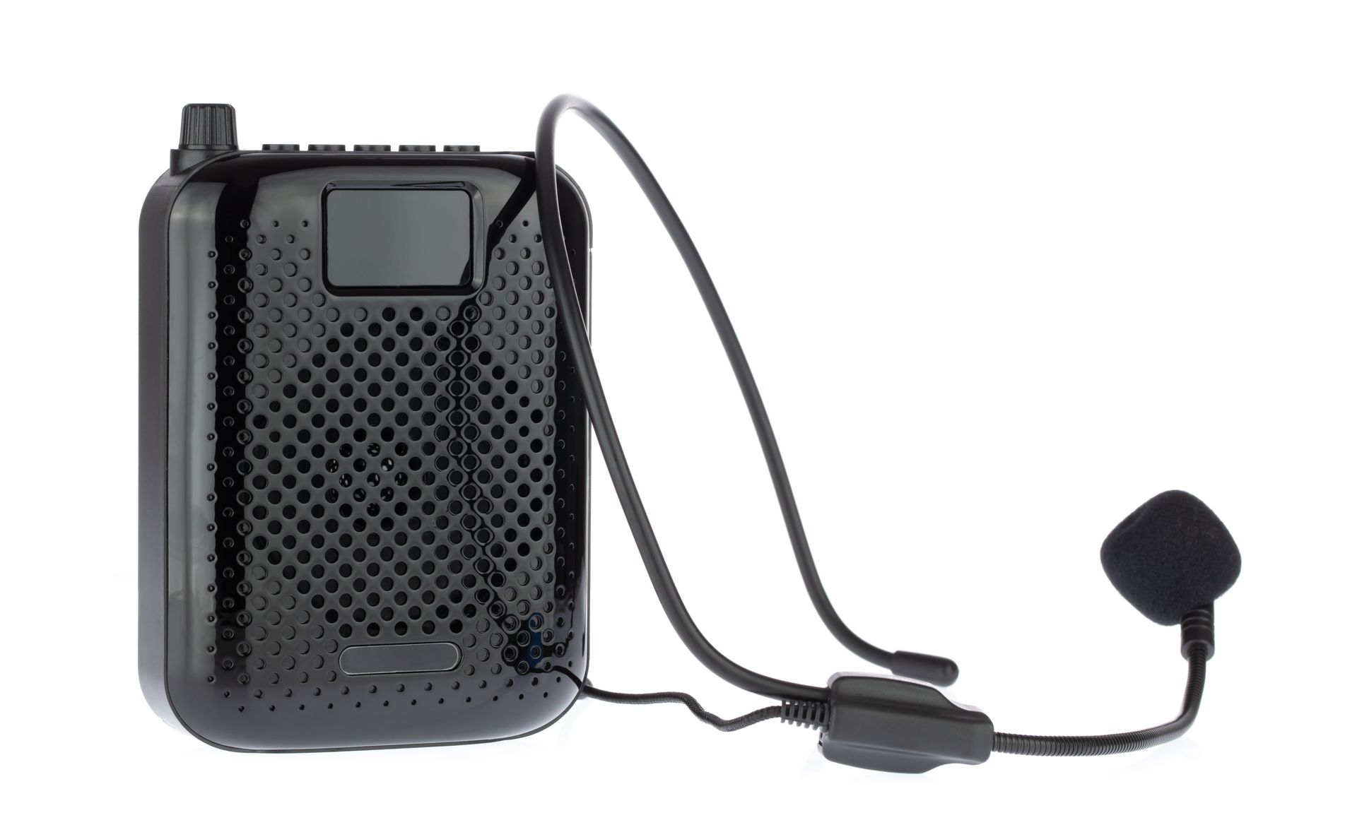 Black wireless bodypack microphone transmitter with clip and headset mic on a white background