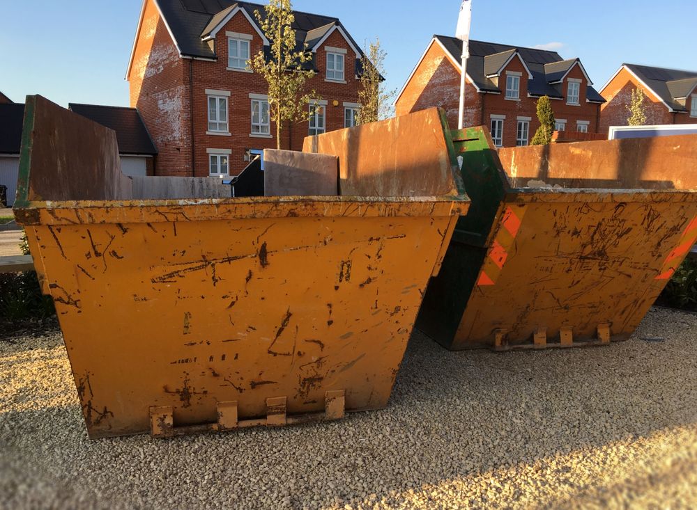 Two Large, Yellow Construction Dumpsters Sit on Gravel — Mount Isa Skips In Camooweal, QLD
