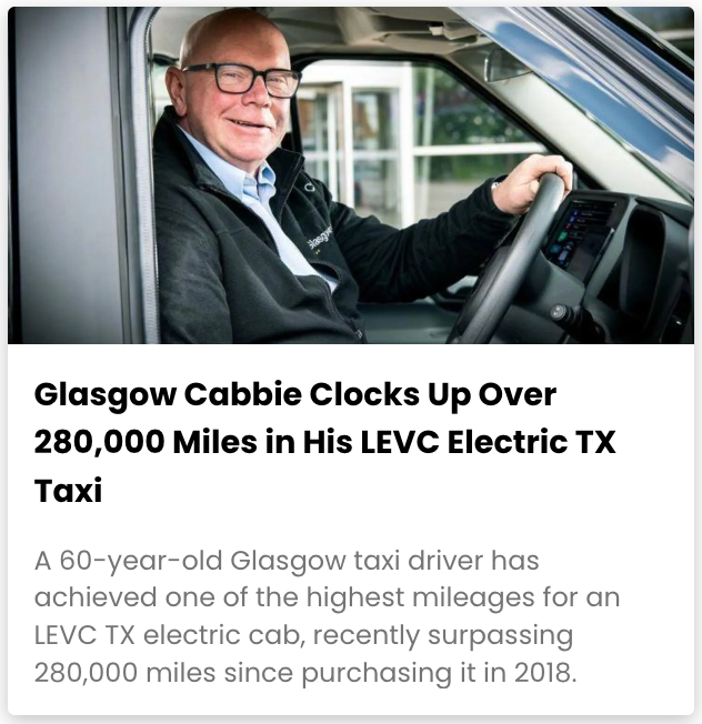 A man wearing glasses is driving an electric taxi