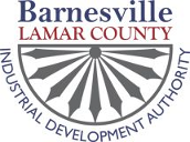 Barnesville Lamar County Industrial Development Authority logo with gray fan emblem and blue/red text
