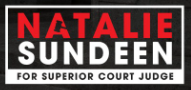 Campaign sign reading “Natalie Sundeen for Superior Court Judge” in red, white, and black.