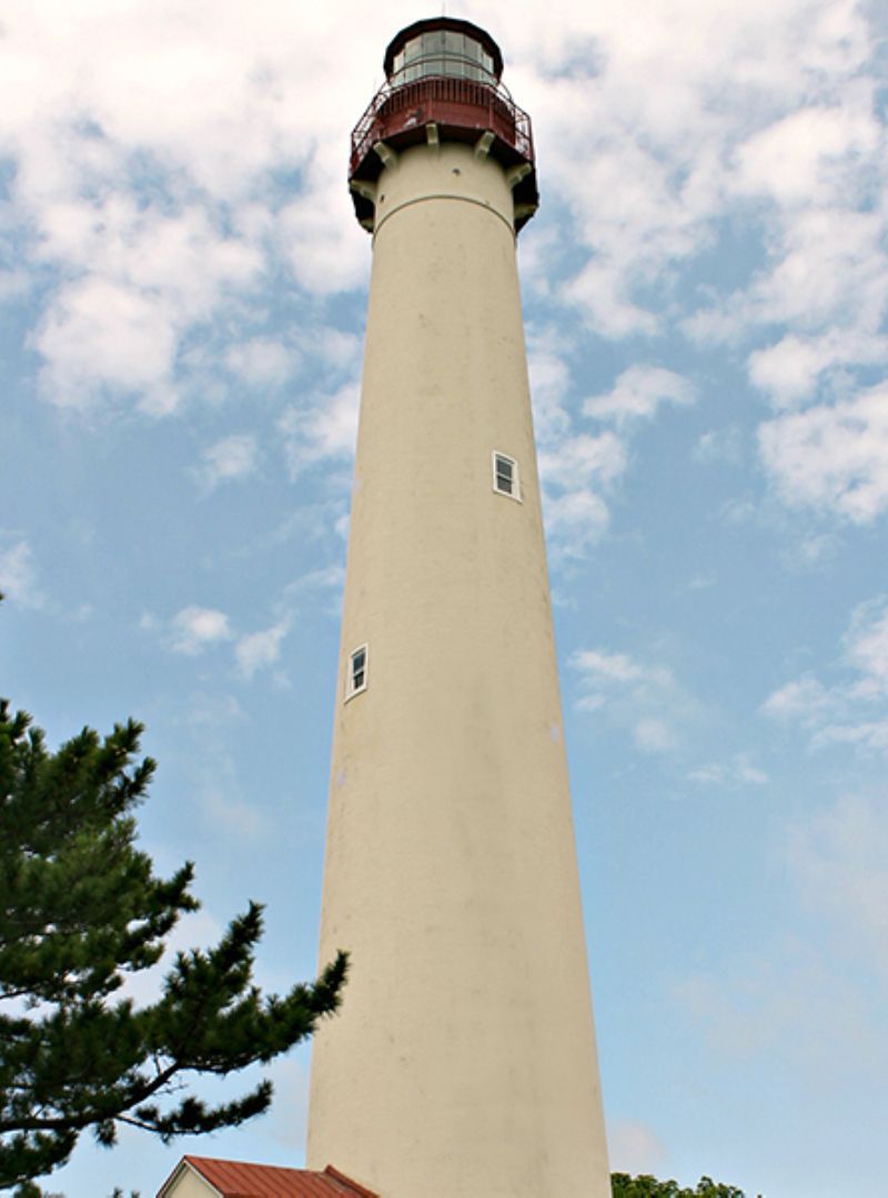 A lighthouse with a blue sky in the background