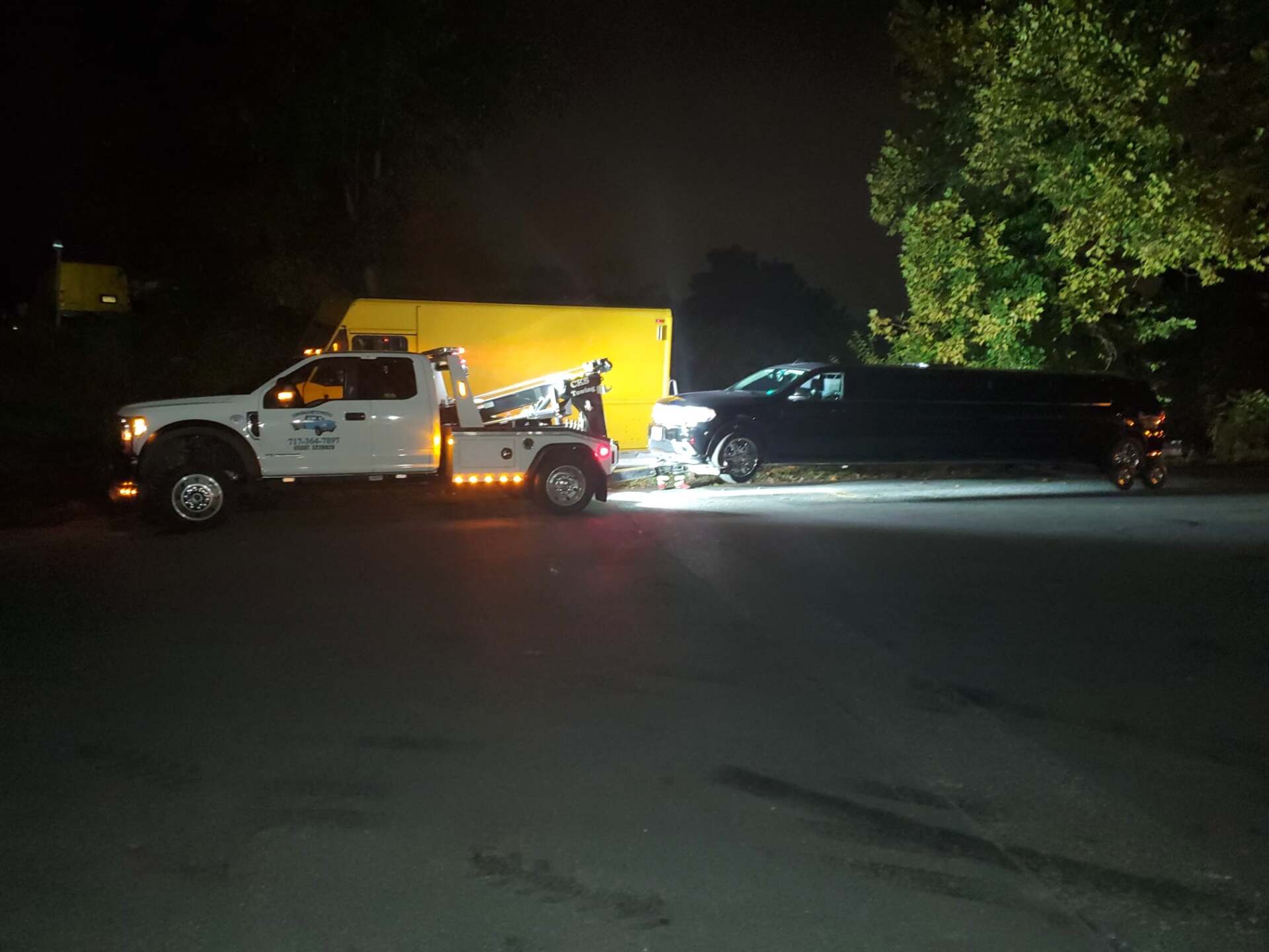 Towing car at night - Harrisburg, PA - Dingman’s Towing and Recovery LLC