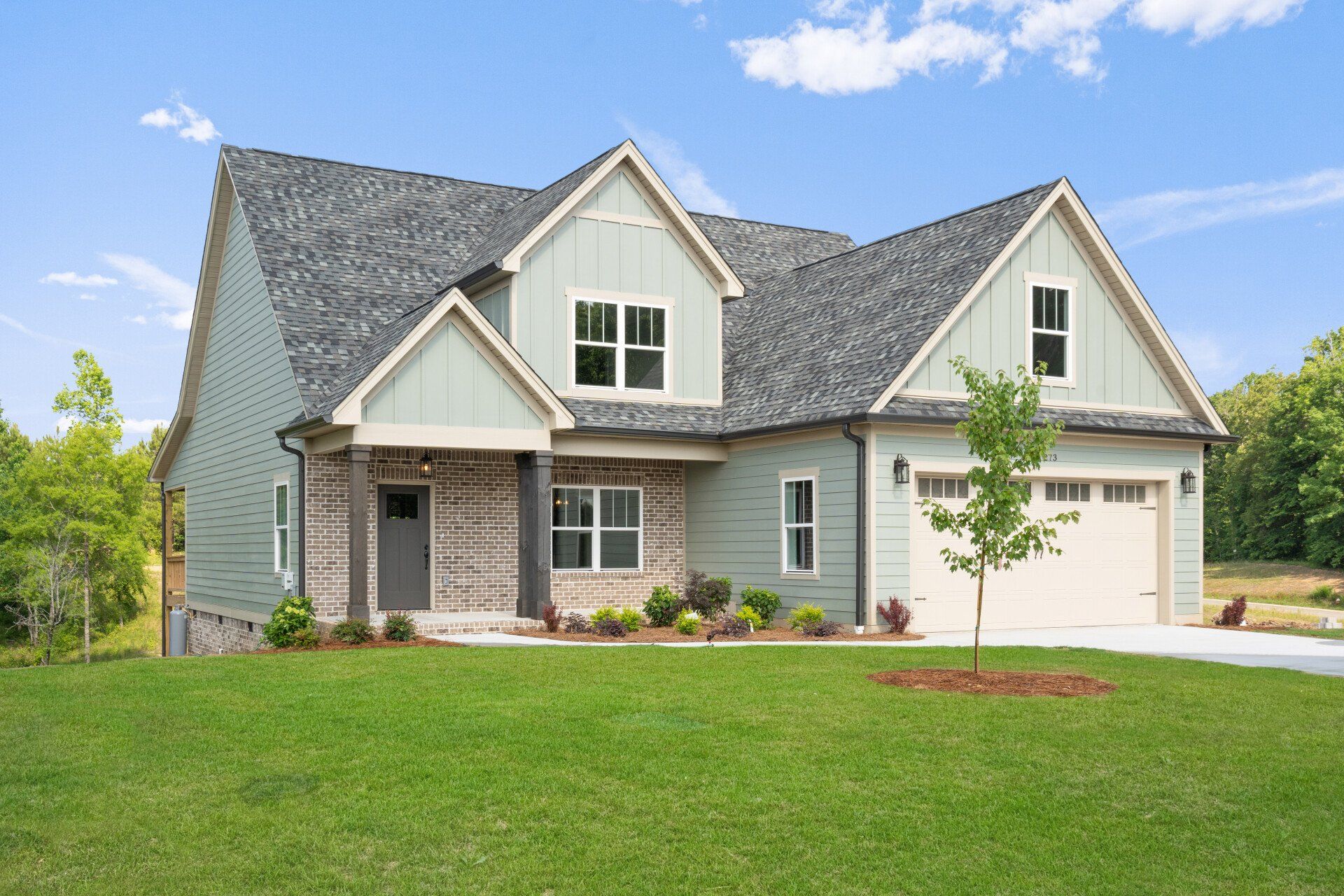 Newly built custom home with craftsman-style exterior, created by Tristar Custom Homes — custom home design services Chattanooga.
