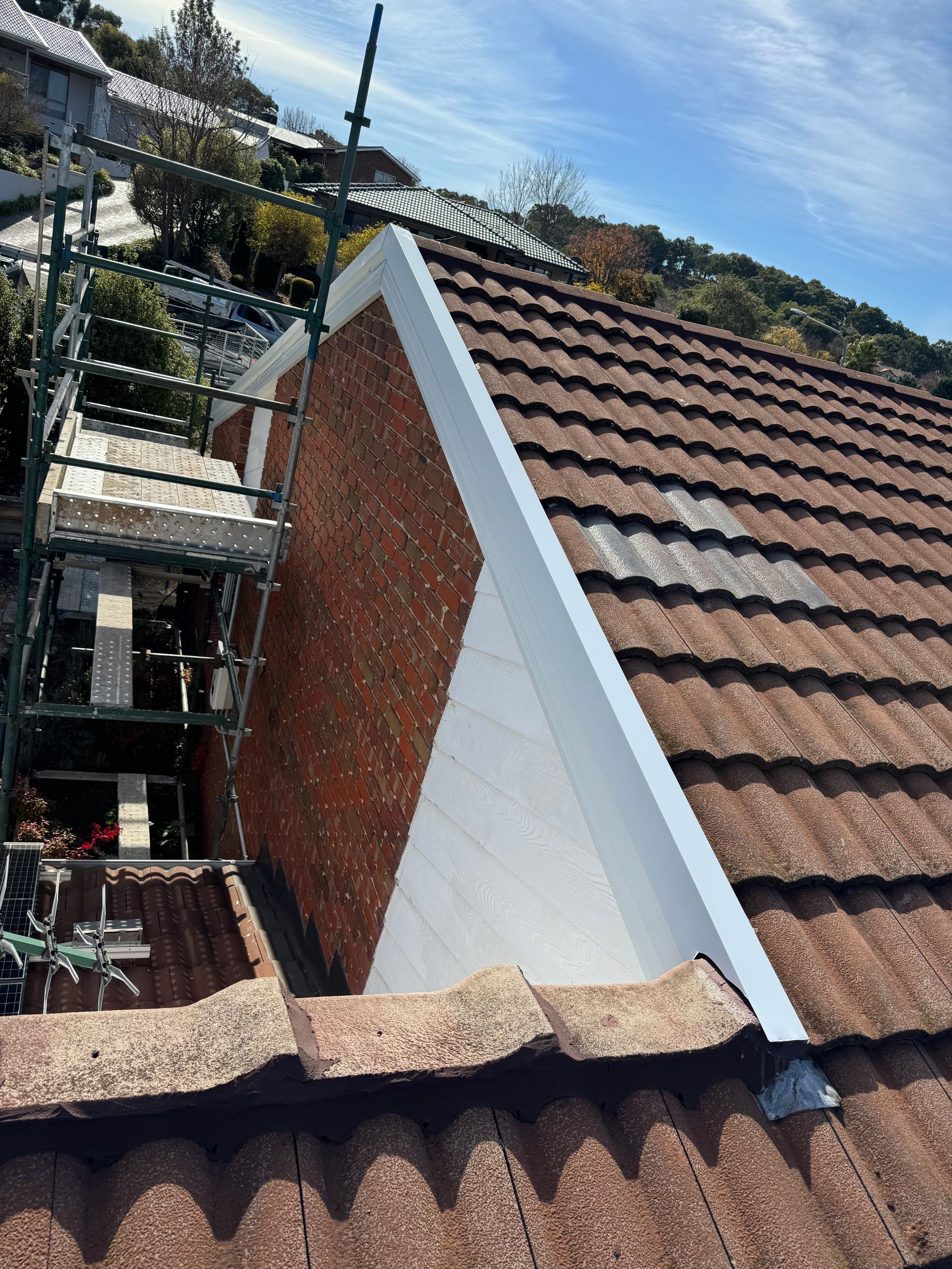 A Tiled Roof Being Repaired — CBR Maintenance In Queanbeyan, NSW