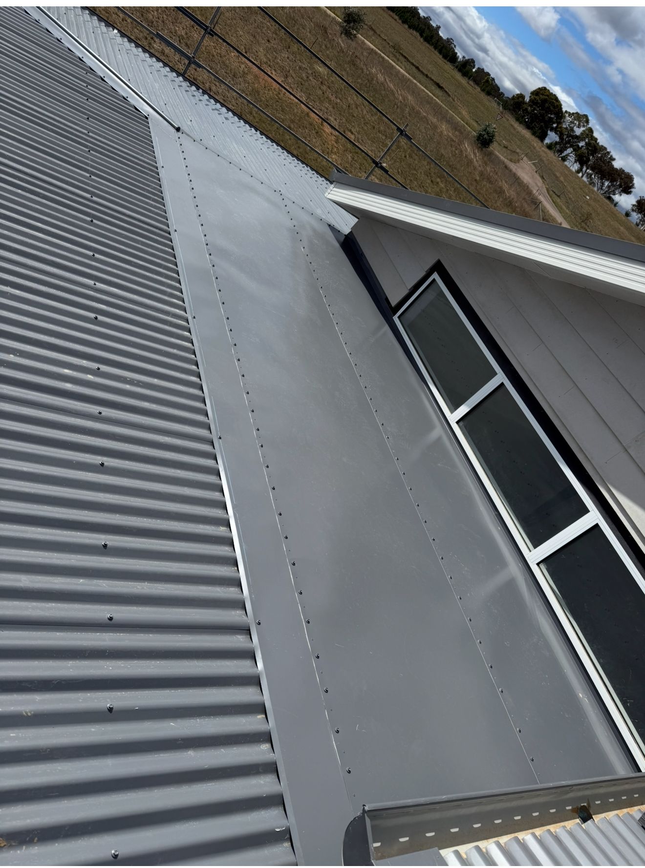 A Close Up of a Grey Colorbond Roof — CBR Maintenance In Queanbeyan, NSW