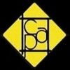 Signo de diamante amarillo con un símbolo circular geométrico negro dentro de un cuadrado con contorno negro.