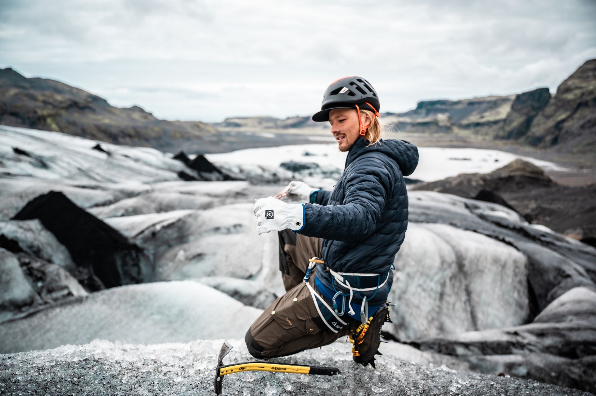 Private glacier hike in Iceland with a certified guide, walking on blue ice with safety gear