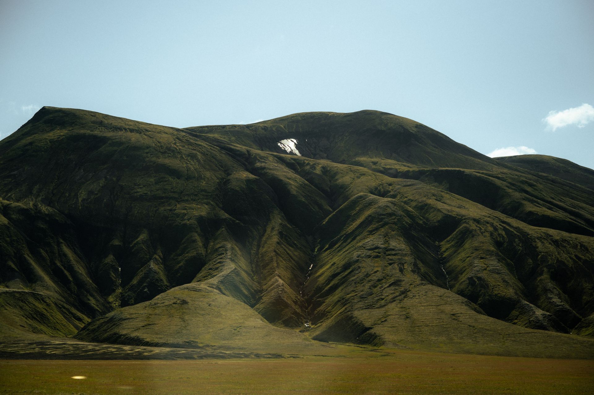 Moody dramatic sky over Icelandic moss fields