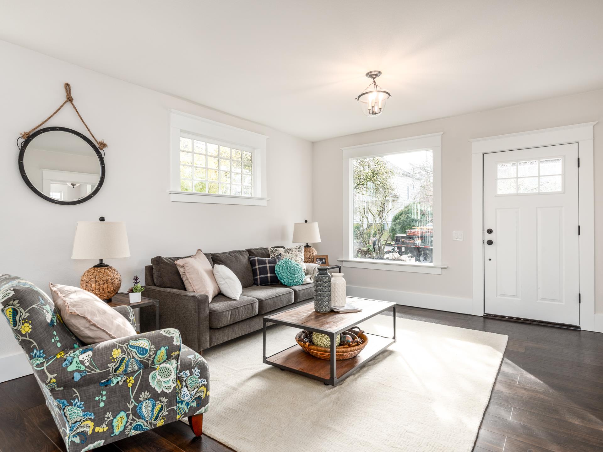 Pictures of a living room with a couch, chair and coffee table.