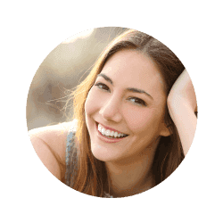 Picture of a women smiling with brown hair.