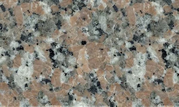 Pink and gray speckled granite countertop close-up