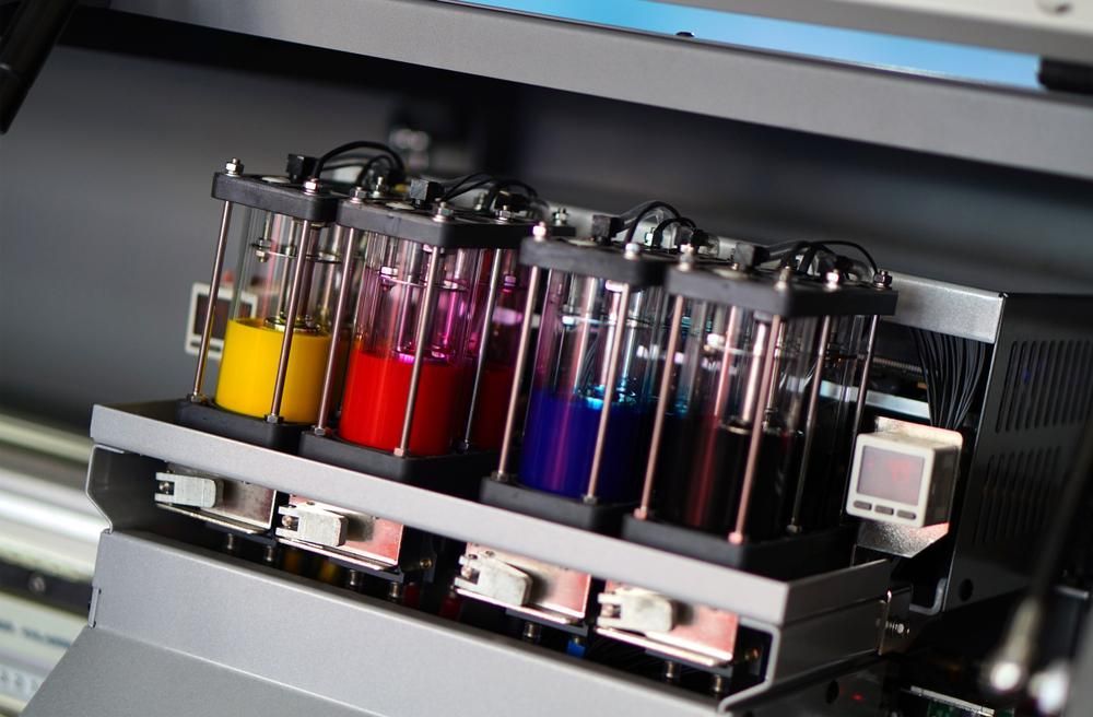 A Close up Of a Printer with Bottles of Ink on It — Imsprint in East Maitland, NSW