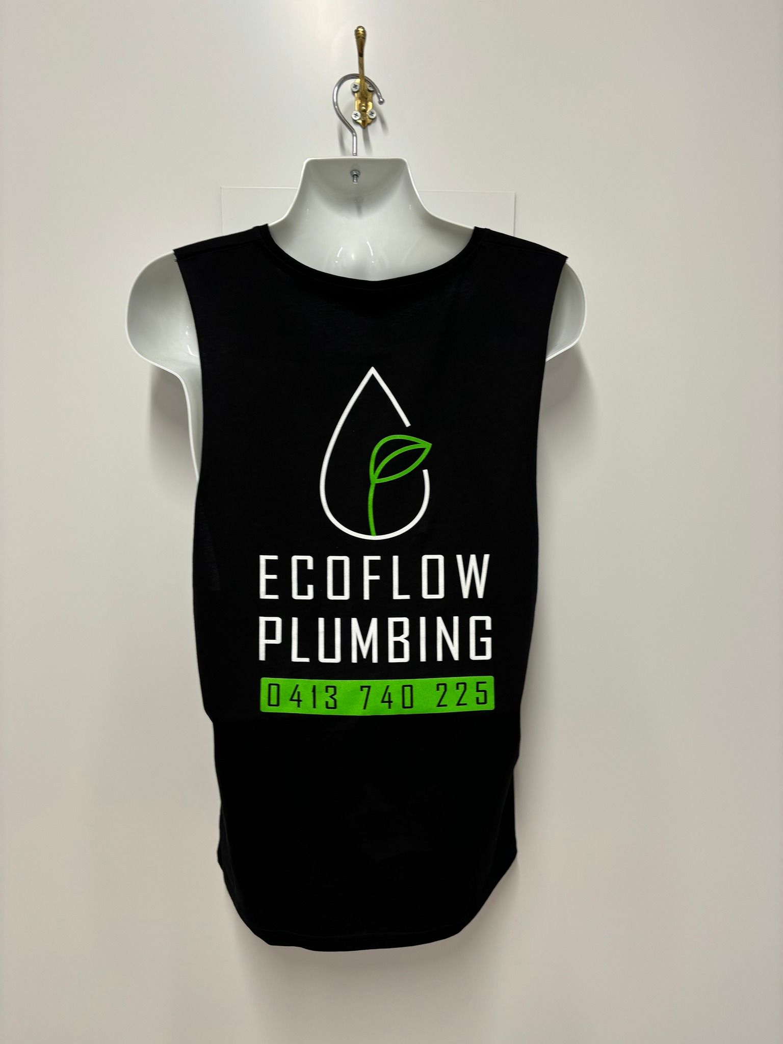 A Person Is Using a Screen Printing Machine to Print a T-Shirt — Imsprint in East Maitland, NSW