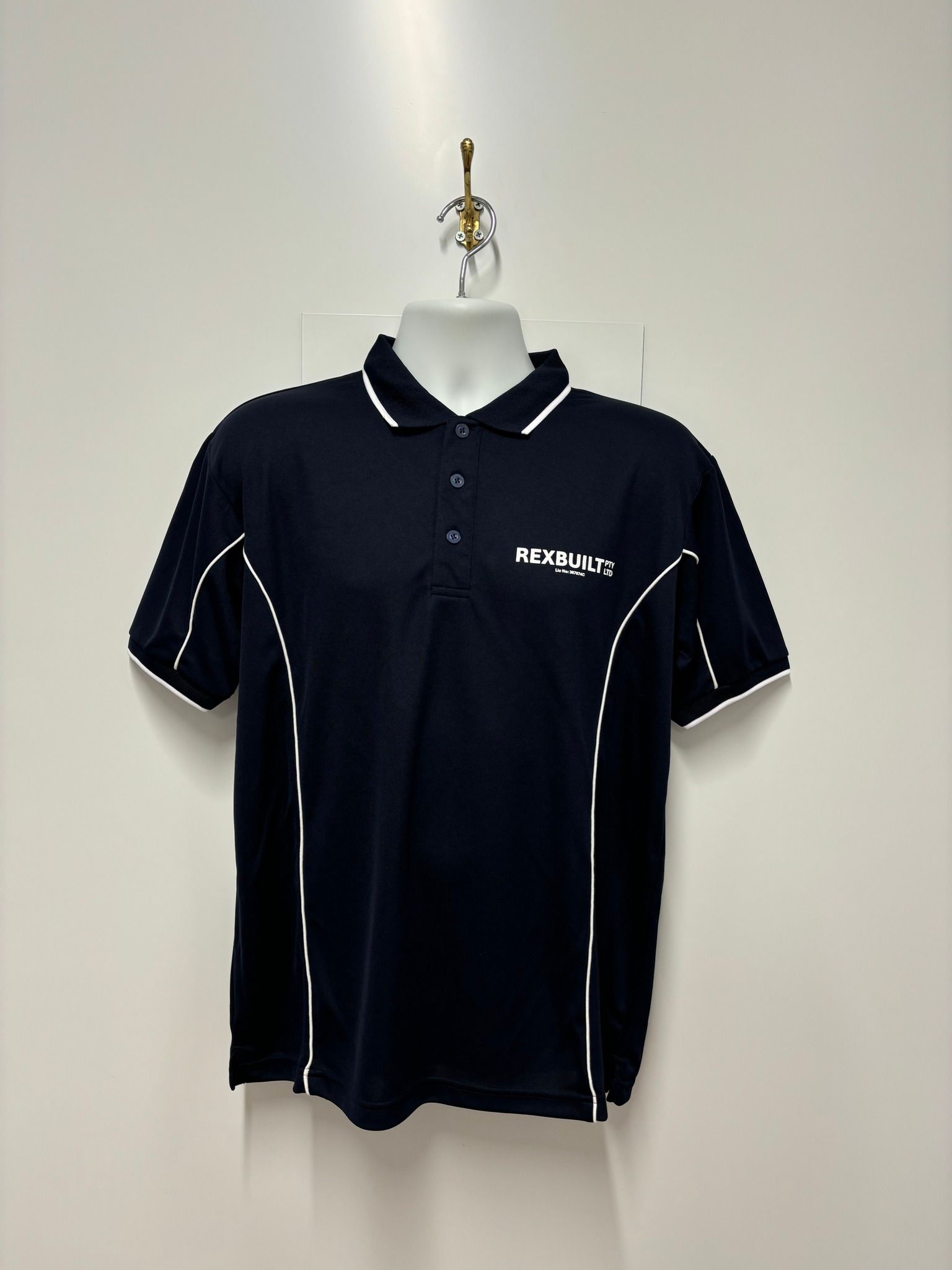 A Machine Is Printing a Black Shirt on A Table — Imsprint in East Maitland, NSW