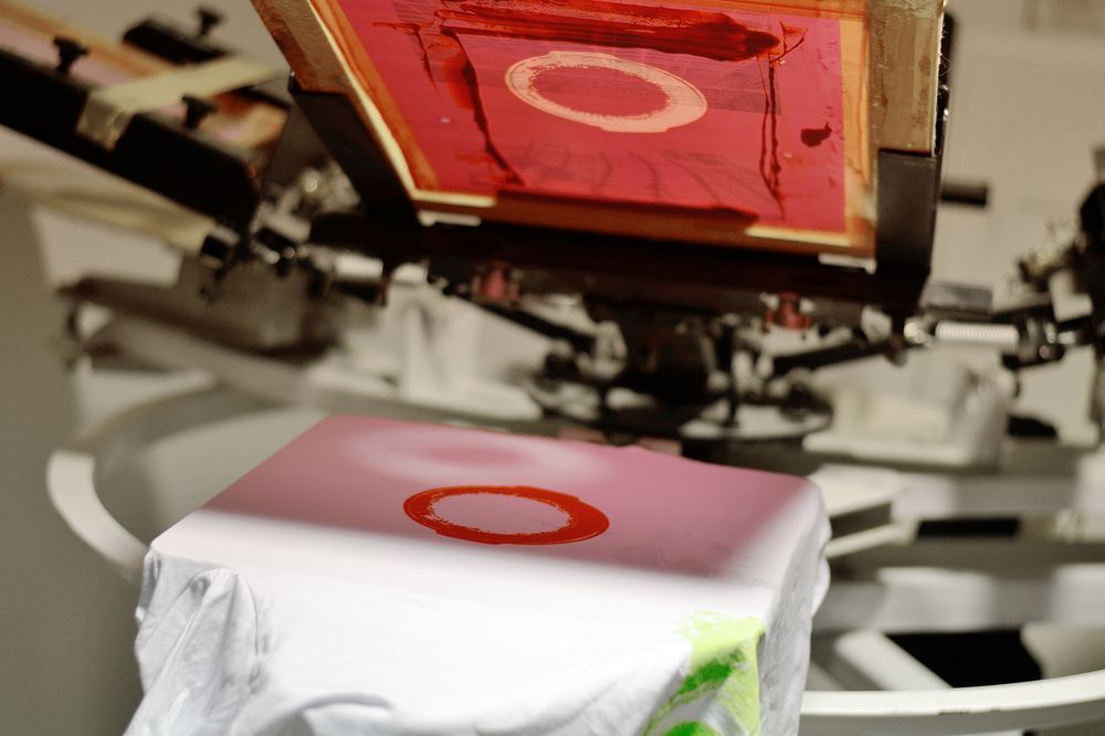 A T-Shirt Is Being Printed on A Screen Printing Machine — Imsprint in East Maitland, NSW