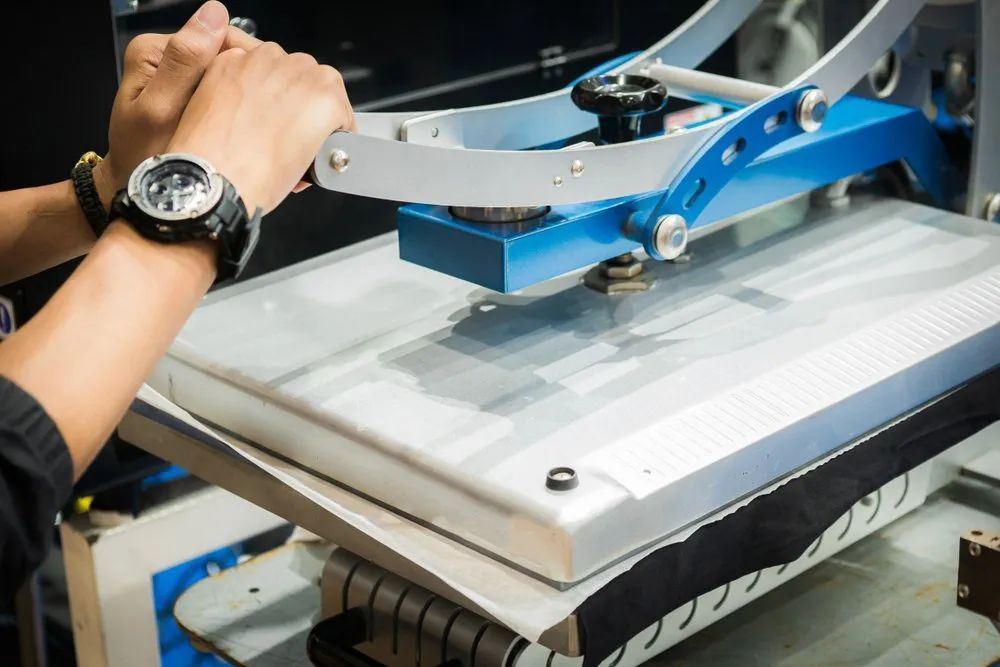 A Person Wearing a Watch Is Working on A Machine — Imsprint in East Maitland, NSW