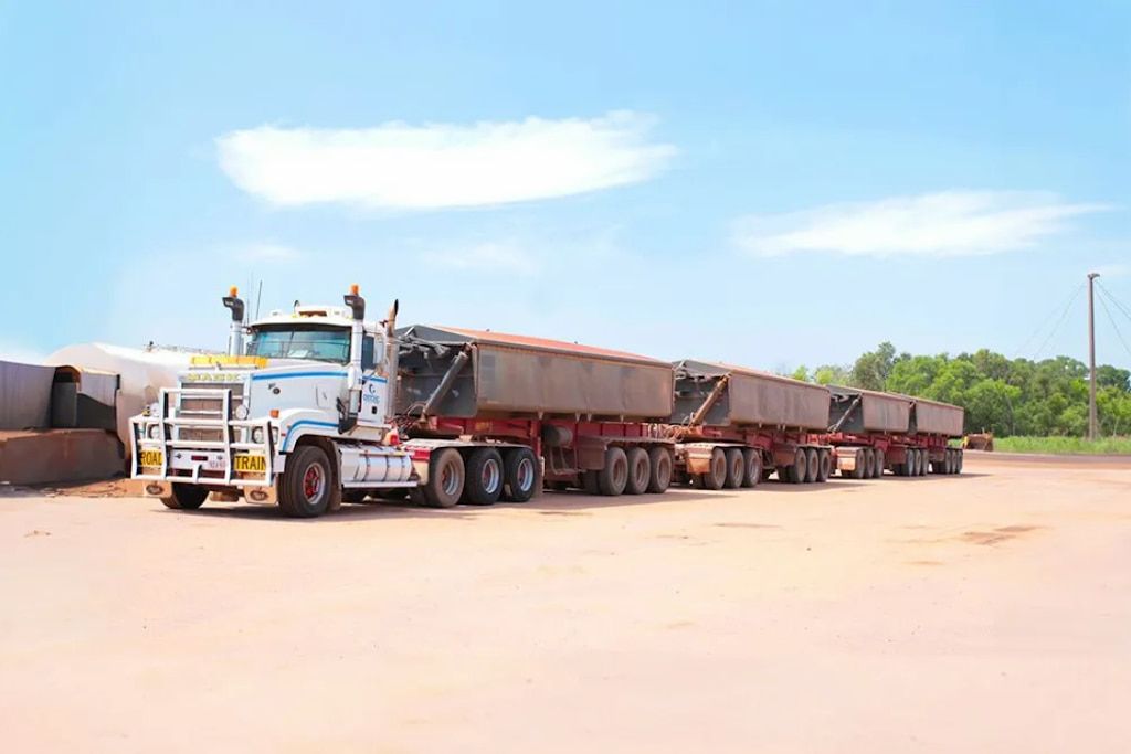 A Large Semi Truck is Parked in a Dirt Lot — Ostojic Group in Berrimah, NT
