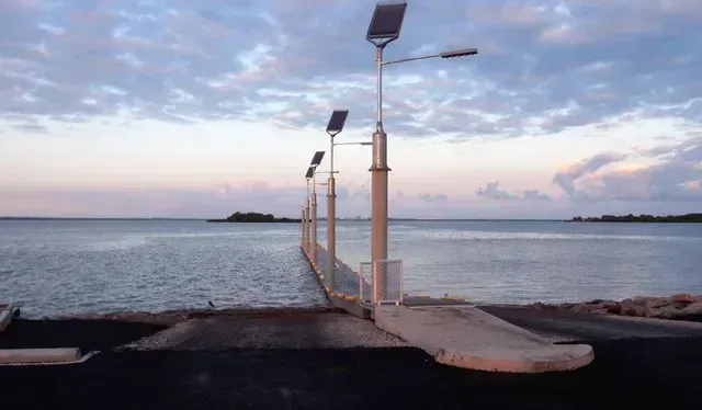 A Bridge Over a Body of Water With a Lot of Lights on It — Ostojic Group in Berrimah, NT