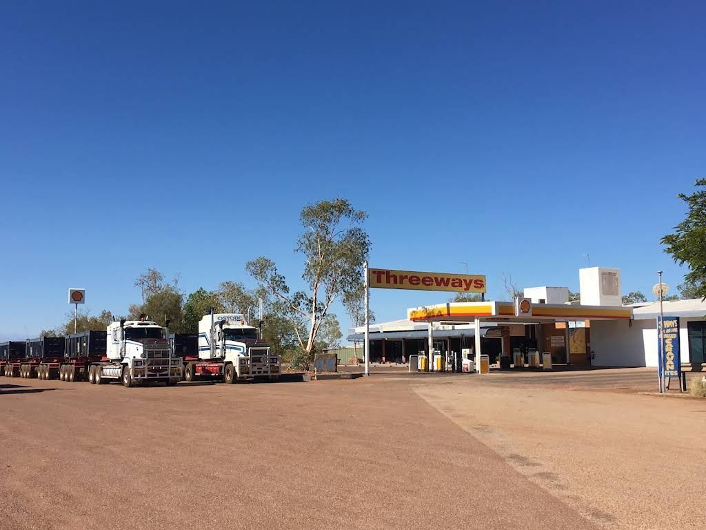Several Trucks Are Parked in Front of a Threeways Gas Station — Ostojic Group in Berrimah, NT
