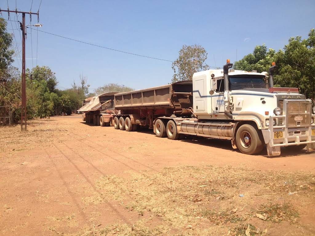 A Dump Truck is Parked on a Dirt Road — Ostojic Group in Berrimah, NT