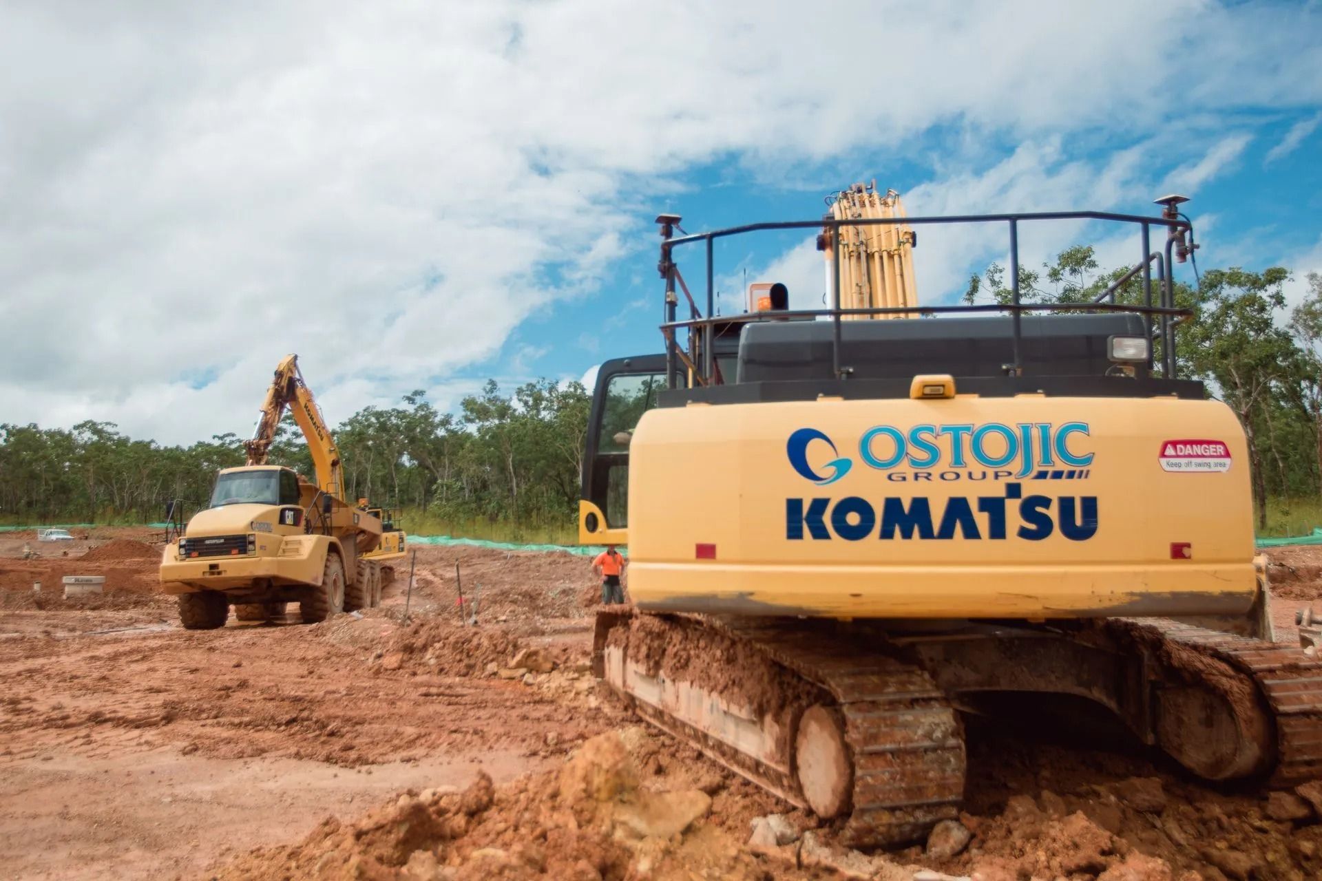 A Construction Site With a Bulldozer and crane — Ostojic Group in Berrimah, NT