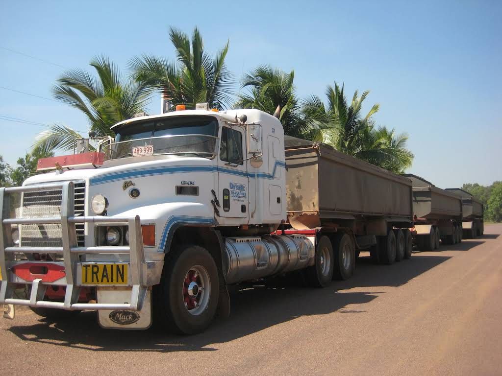 A White Truck With a Yellow License Plate That Says Train — Ostojic Group in Berrimah, NT