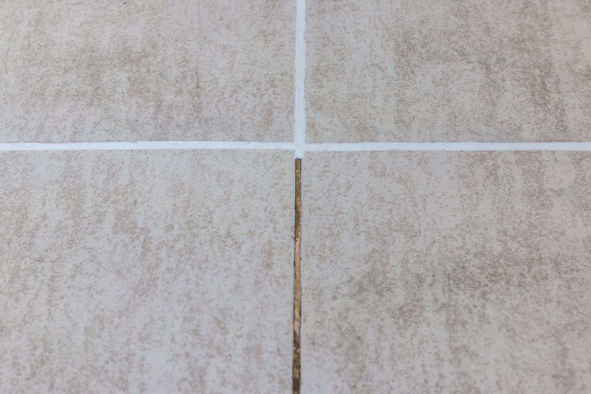 Before and after results of professional grout cleaning on stone floor tiles. Before and after results of professional grout cleaning on stone floor tiles.