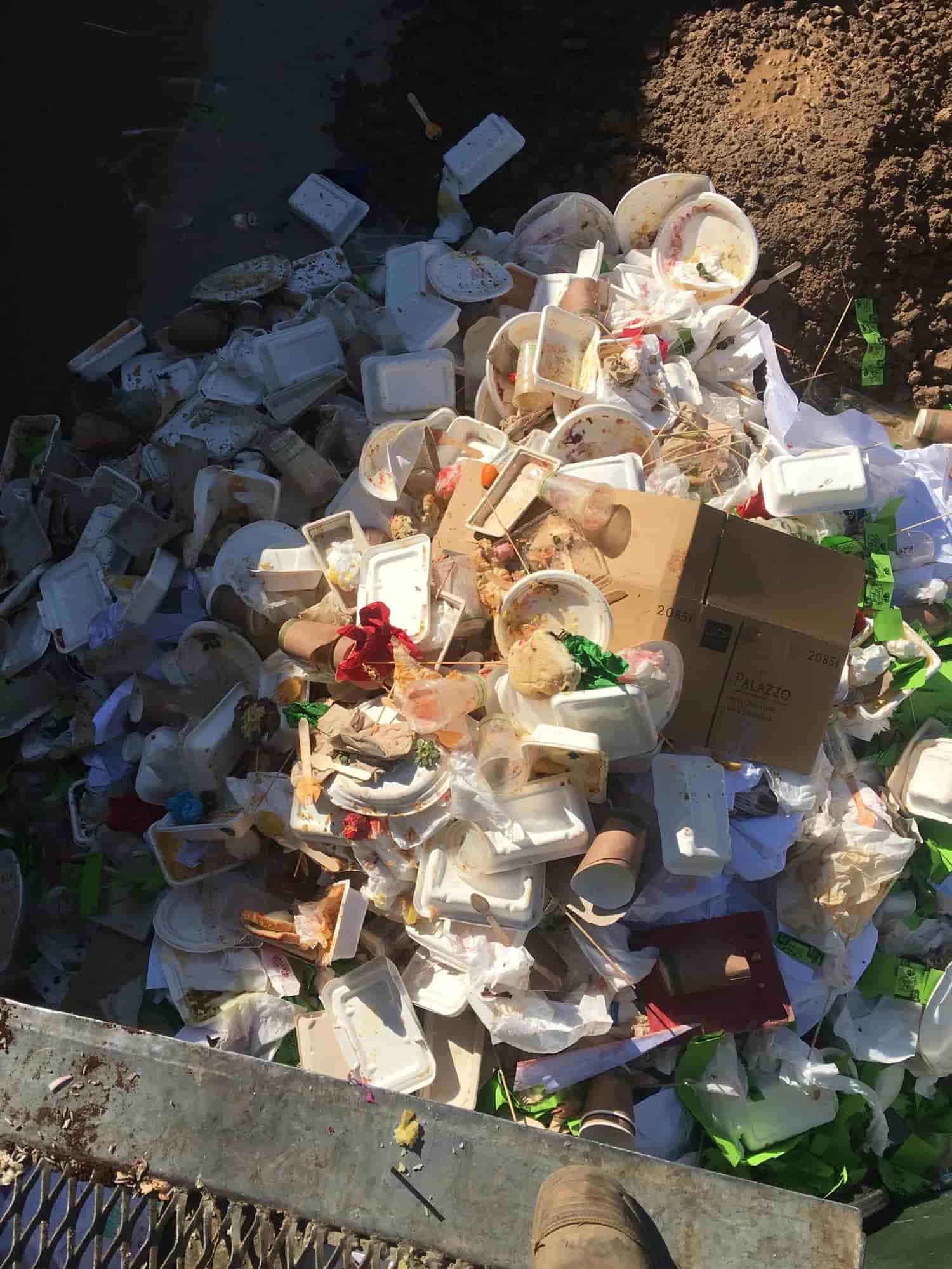 A Pile Of Trash Is Sitting On The Ground Next To A Fence — Party Bins Pty Ltd In Landsborough, QLD