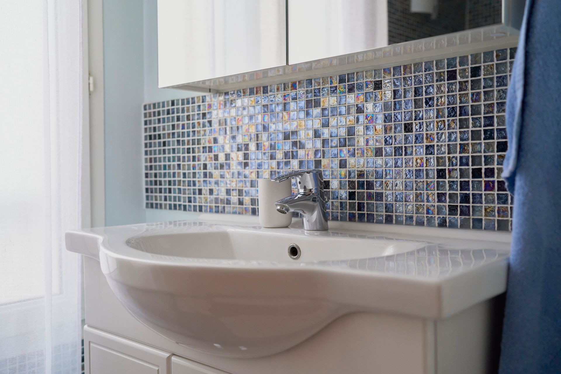 Modern bathroom sink with mosaic tiles Modern bathroom sink with mosaic tiles