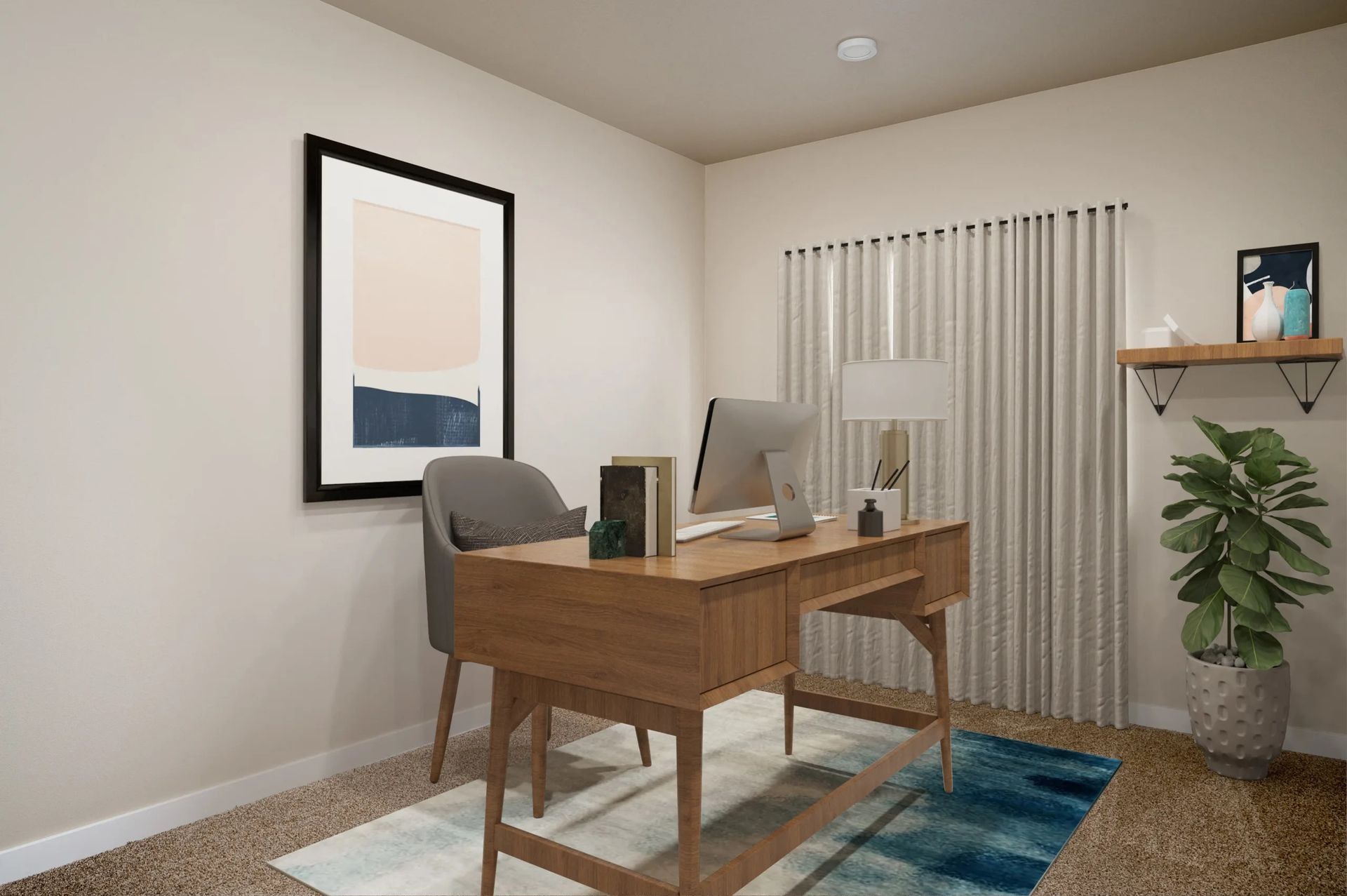 Home office with wooden desk, gray chair, wall art, plant, and computer in a beige room.