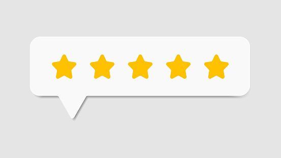 White speech bubble with five gold stars on a light gray background