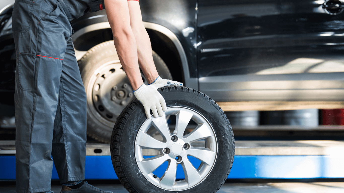 mechanic doing a tire rotation