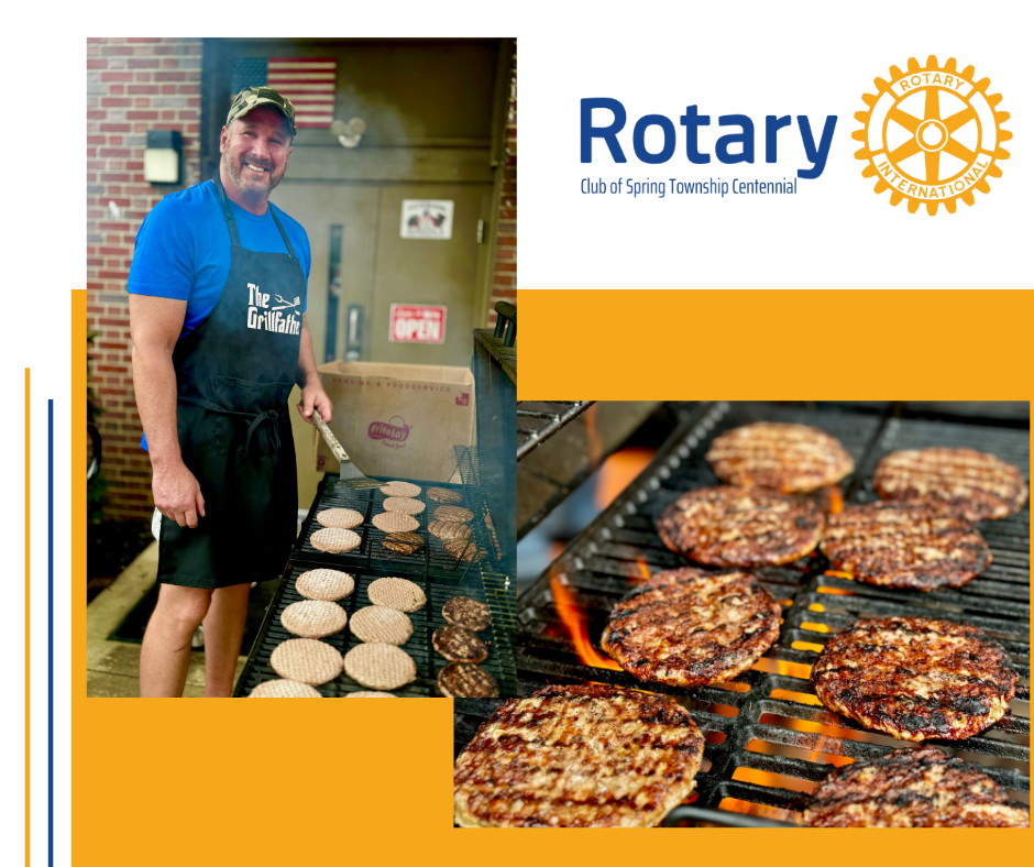 A man is cooking hamburgers on a grill in front of a rotary logo.