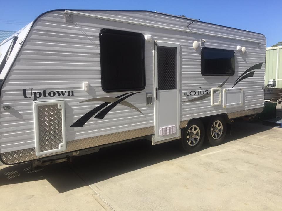 A white rv is parked on the side of the road - Plastiglass Mid North Coast, NSW