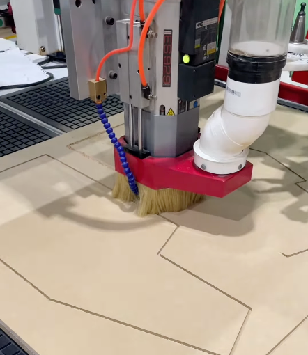 A machine is cutting a piece of wood with a brush attached to it - Plastiglass Mid North Coast, NSW