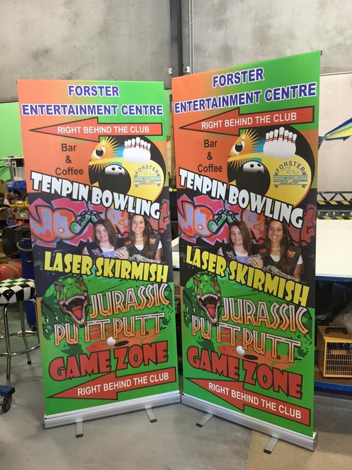 A couple of banners sitting on top of a table - Plastiglass Mid North Coast, NSW