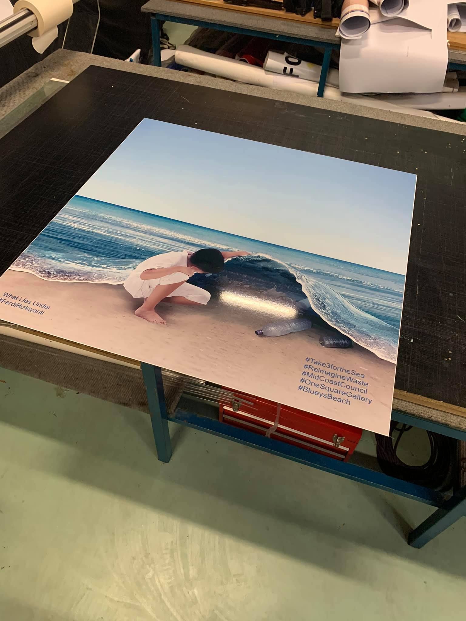 A canvas picture of a woman kneeling on a beach - Plastiglass Mid North Coast, NSW