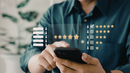 Person using a smartphone with overlaid star ratings and review bars in a blurred office setting