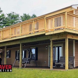 A House With A Large Wooden Deck And Porch — Evansville, IN — Red Beaver Construction