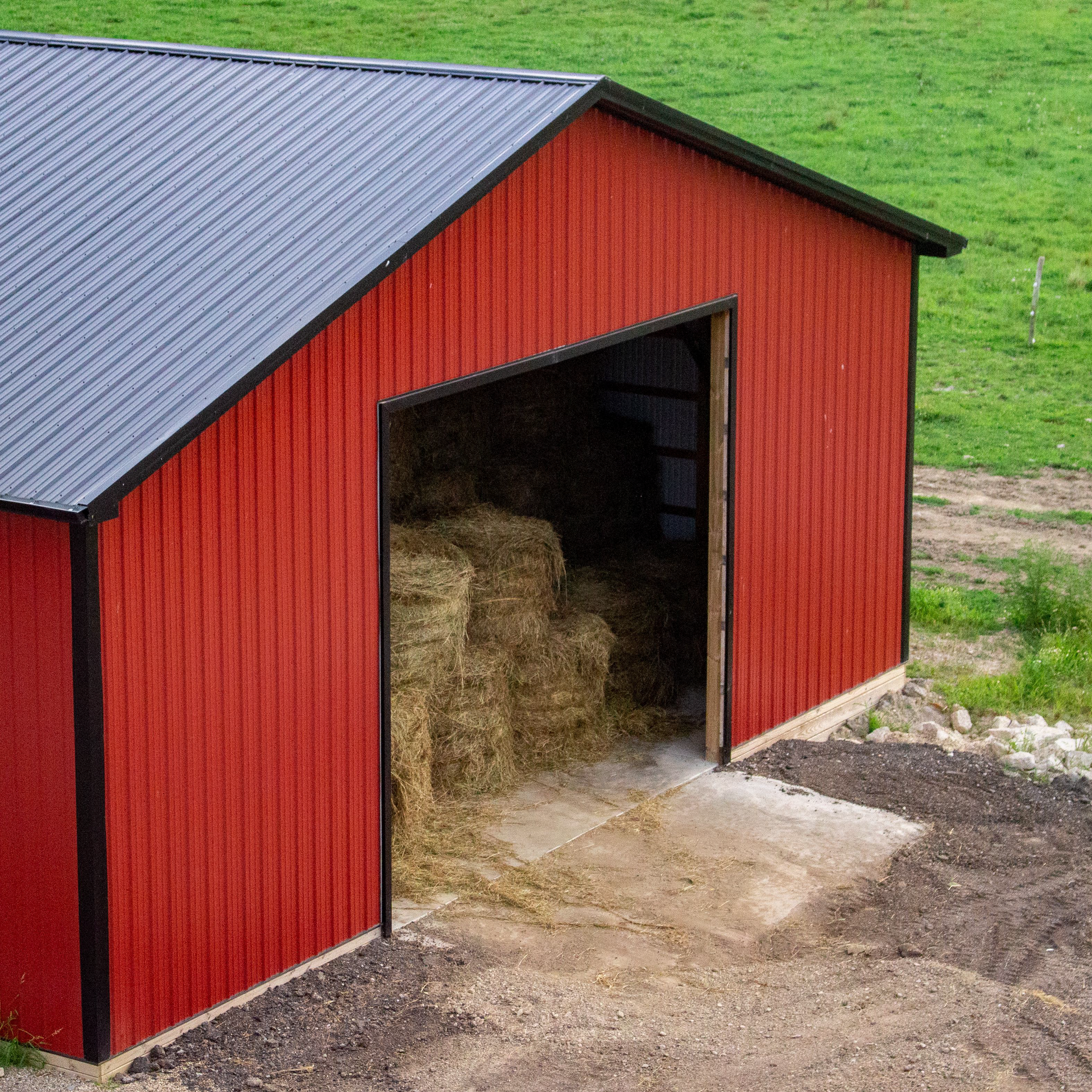 Aerial shot of a completed pole barn project by Red Beaver Construction on a sunny day.