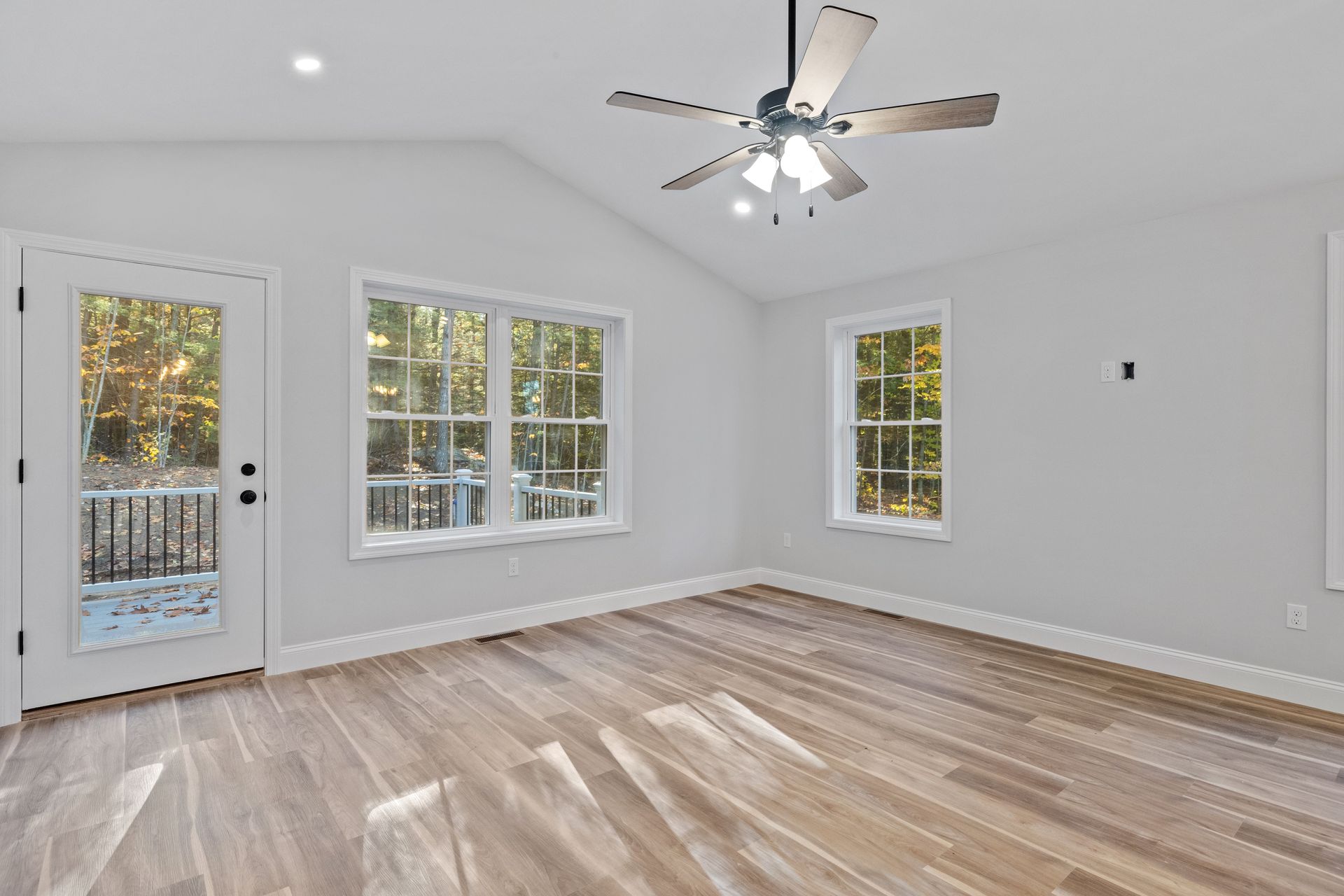Newly added sunlit family room by Red Beaver Construction, seamlessly blending with the original home in Evansville, IN.