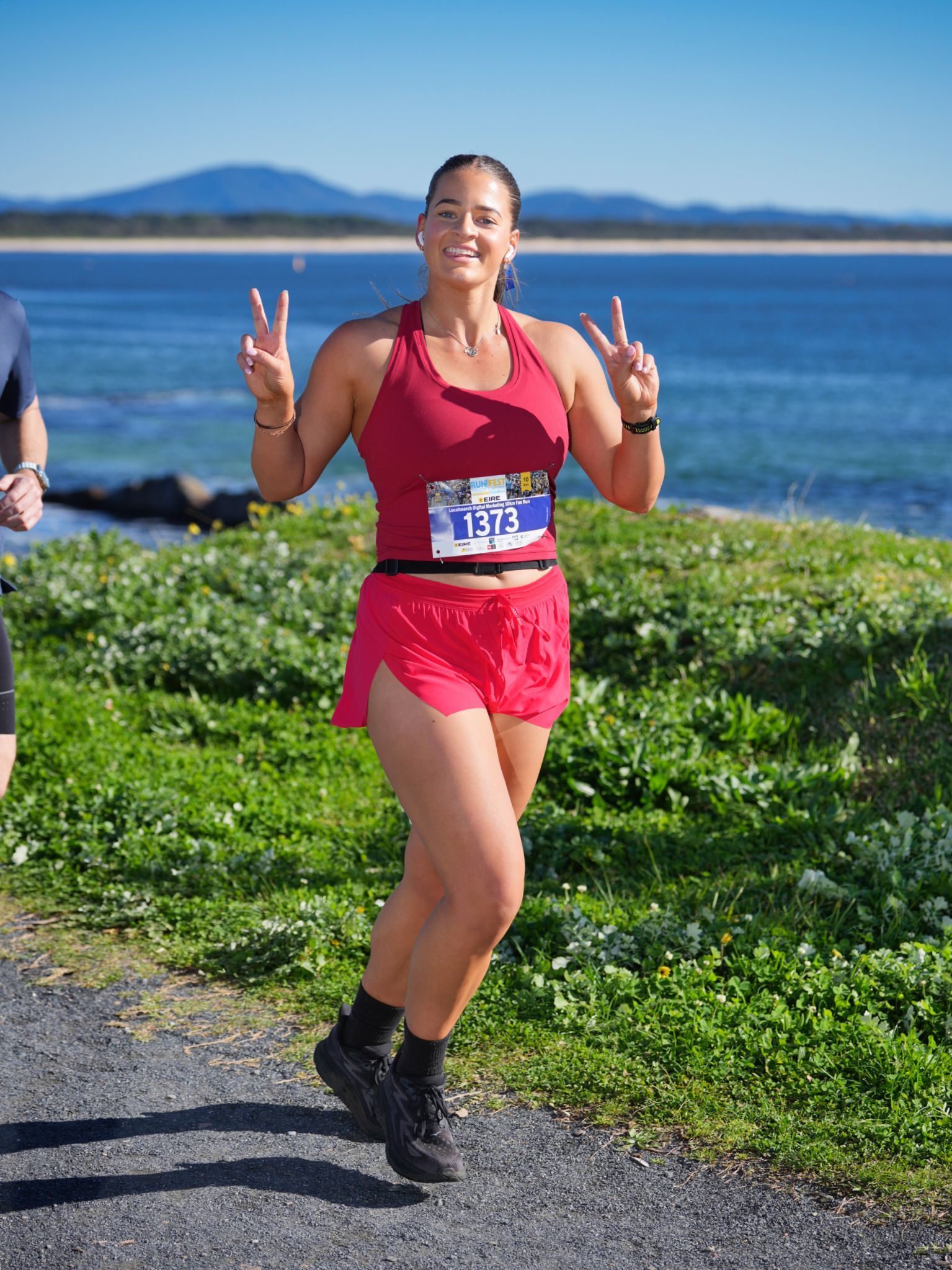 Two Women Are Walking Along A Path Next To A Body Of Water — Run Fest in Forster - Tuncurry, NSW