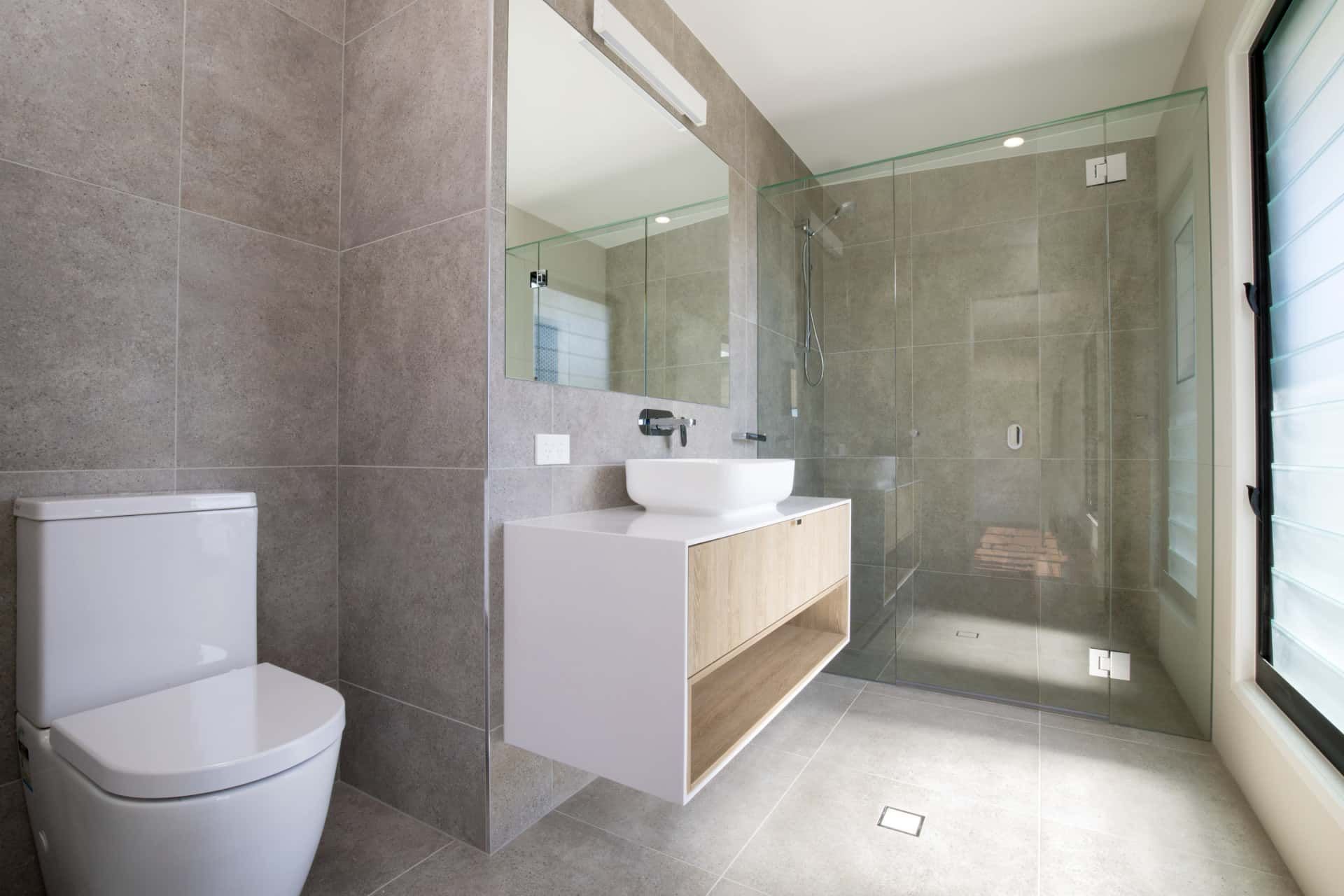 Modern Bathroom with Gray Tiled Walls and Floors — Frameless Shower Installations, Sunshine Coast