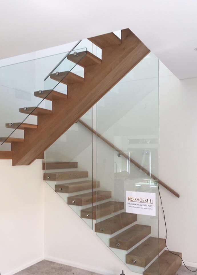 Timber staircase with a frameless glass balustrade — Frameless Shower Installations, Sunshine Coast.