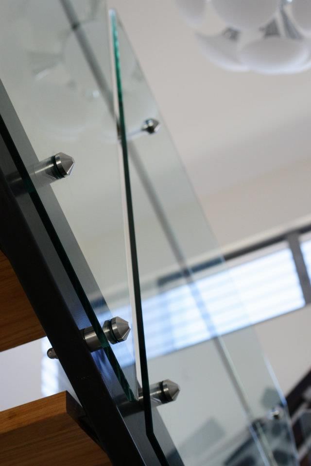 A Close Up of a Glass Railing on a Staircase — Frameless Shower Installations In Noosa, QLD