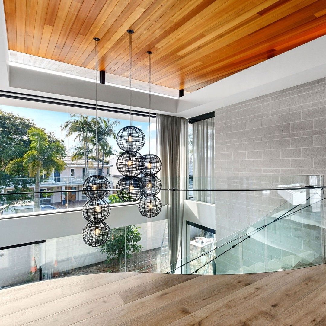 A Kitchen With White Cabinets and a Blue Counter Top — Frameless Shower Installations in Mooloolaba, QLD