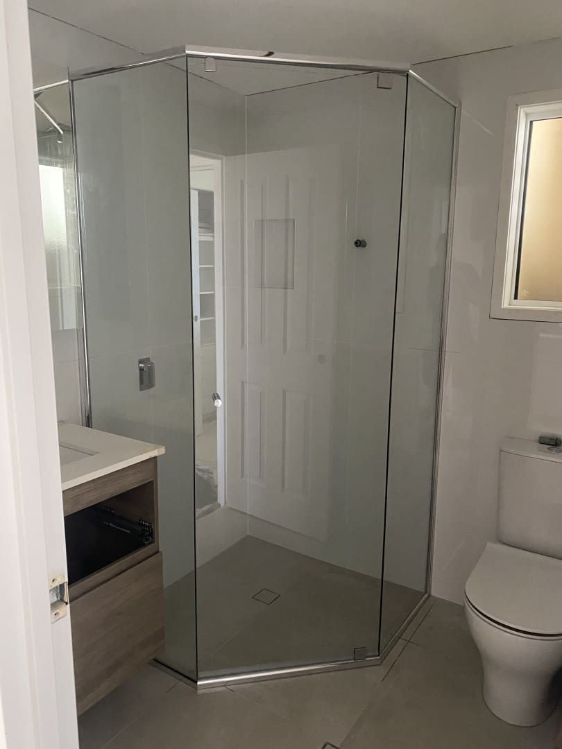 Modern Bathroom With a Frameless Glass Shower Enclosure — Frameless Shower Installations In Caloundra, QLD 